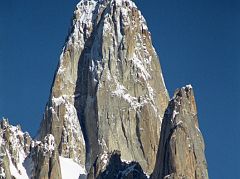 13 Uli Biaho Tower Close Up From Khoburtse Just After Sunrise Uli Biaho Tower shines in the early morning sun from Khoburtse. The first ascent of Uli Biaho Tower (6109m) was made on July 3, 1979 by John Roskelley, Kim Schimtz, Ron Kauk and Bill Forrest via the east face. �One by one, each of us climbed to its broad top, soaked in the evening�s warmth, cried a little, laughed a little, and, for just a few brief moments, forgot the cold, thirst, and danger below.� - Stories Off The Wall by John Roskelley.